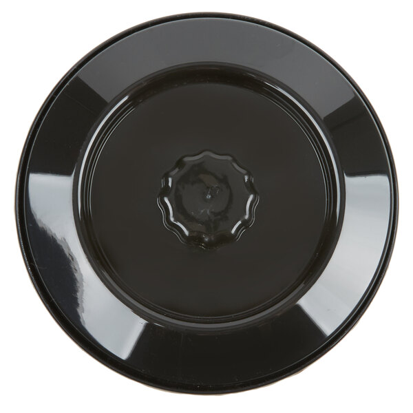 A black plate with a ring on it.