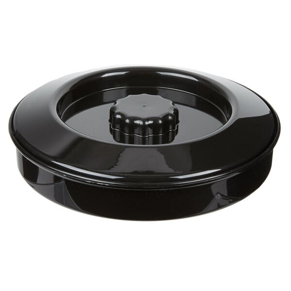 A black plastic container with a round cap and a circular design with a knob.