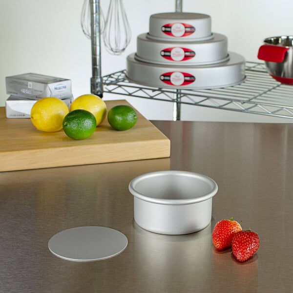 A Fat Daddio's round cheesecake pan on a kitchen counter.