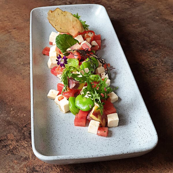 A rectangular Corona Moon platter with food on it.