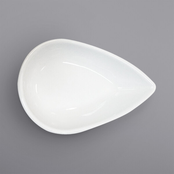 A bright white porcelain teardrop plate with a circle in the middle.