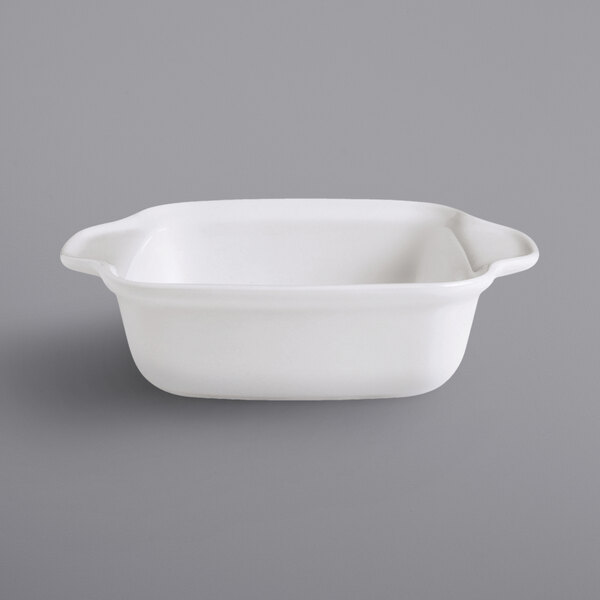 a white square bowl with handles