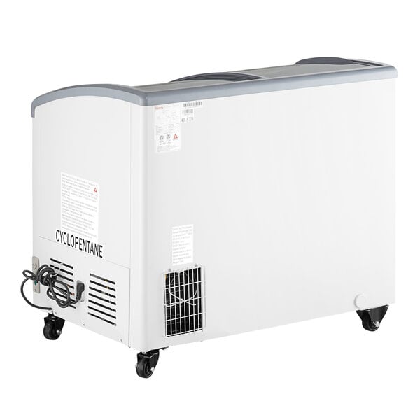 A white Galaxy curved top display freezer on wheels.