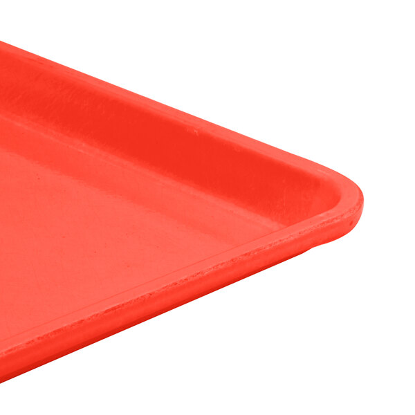 A close up of a red Cambro dietary tray.