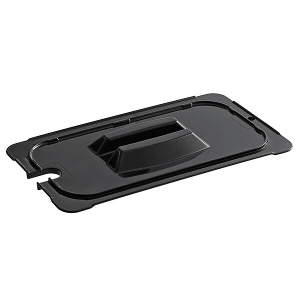 A black rectangular plastic lid with a black handle on a black rectangular food pan.
