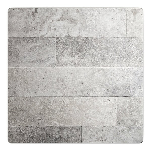 A square table top with a textured gray stone-like Toscano finish.