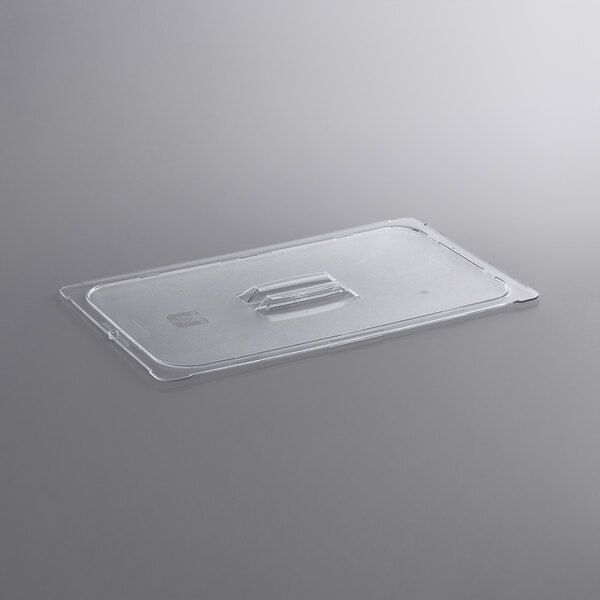 A clear plastic food pan lid with a handle.