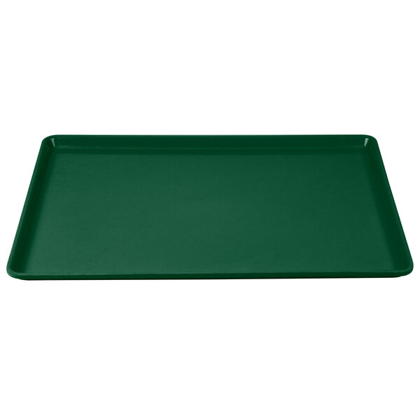 A green Cambro dietary tray with a white border.