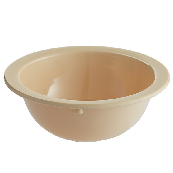 A tan melamine bowl with a white rim.