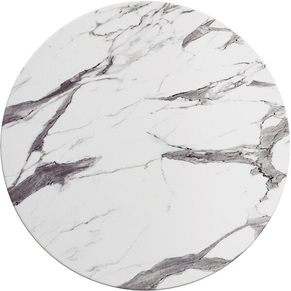 A white and black marble Lancaster Table & Seating round table top.