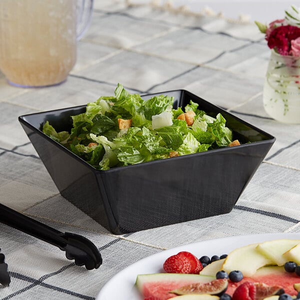 a bowl of salad on a table