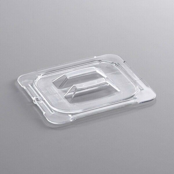 A clear plastic lid with a handle.
