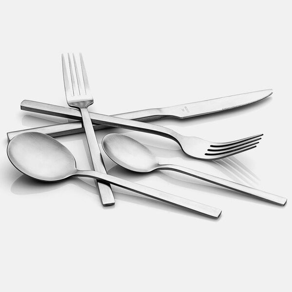A Libbey stainless steel dinner fork and spoon on a white table