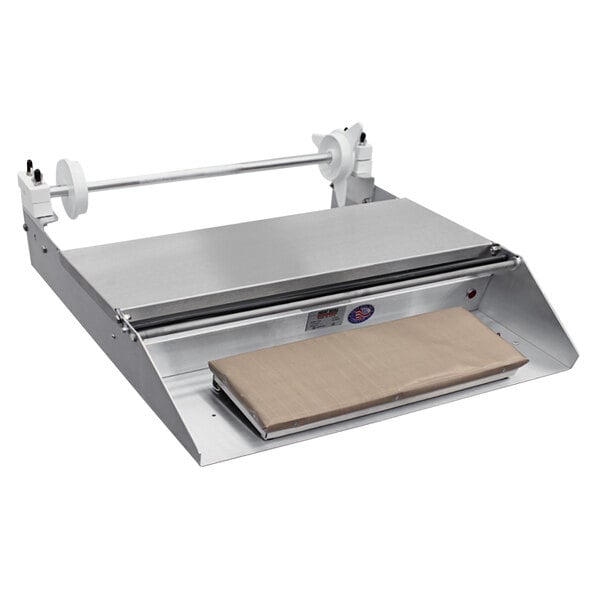 A Heat Seal countertop wrapping machine with a roll of film in it.
