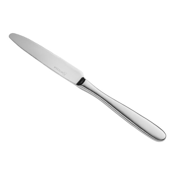 A close-up of a Fortessa Grand City stainless steel dinner knife with a silver handle.