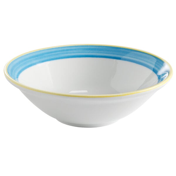 A white Corona by GET Enterprises porcelain bowl with a blue and yellow striped rim.