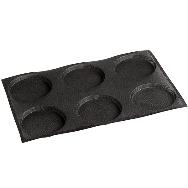 A black Sasa Demarle baking tray with six circle cavities.