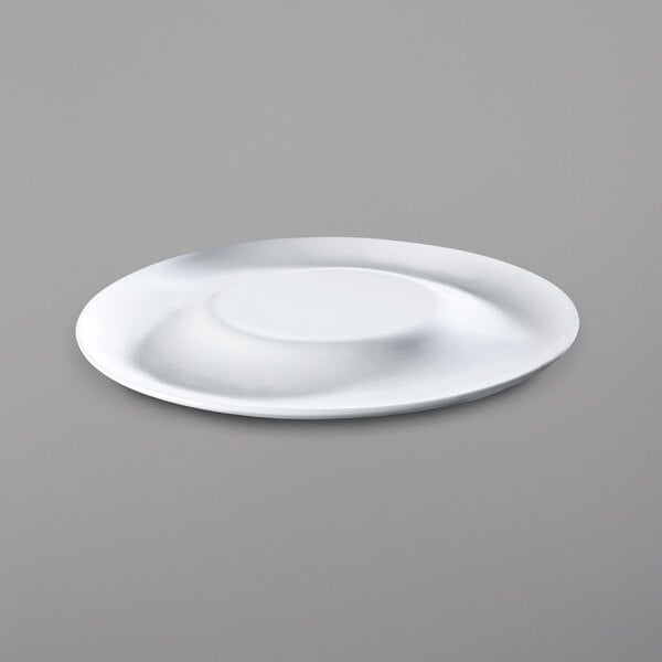 A close up of a bright white porcelain plate with a circular rim.