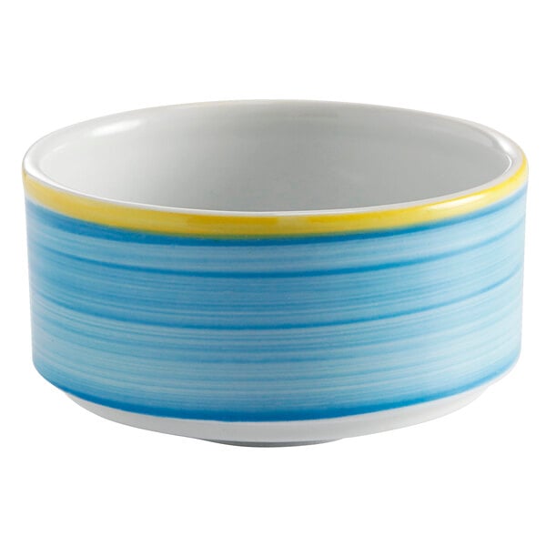 A close up of a blue bowl with a yellow stripe.
