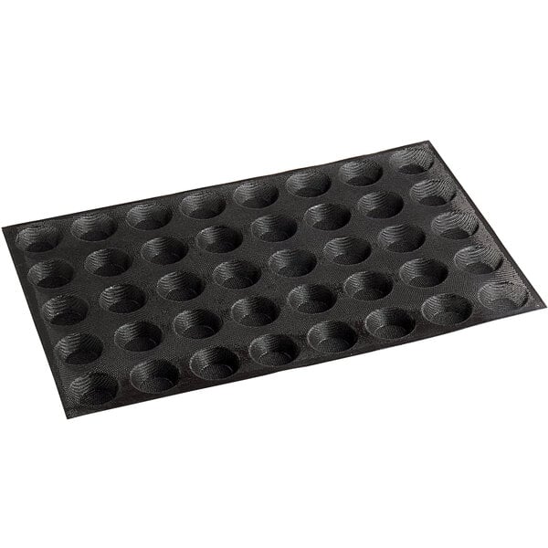 A black silicone baking tray with 40 mini tartlet cavities.