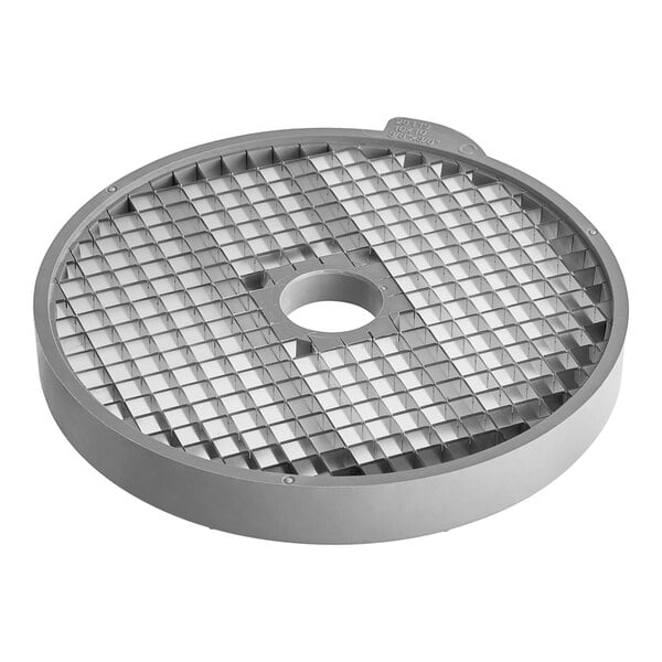 A grey circular metal dicing grid with a hole in the center.