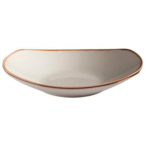 A beige porcelain pasta coupe bowl with a brown rim.