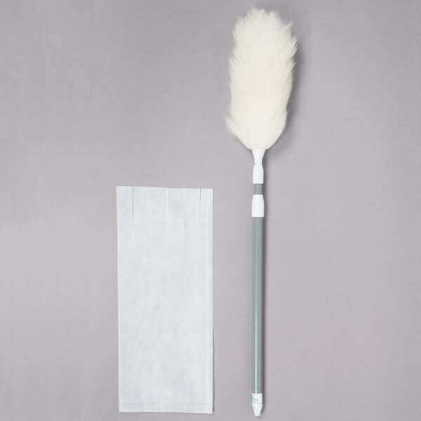 A Unger ProDuster with a white feather on a pole.