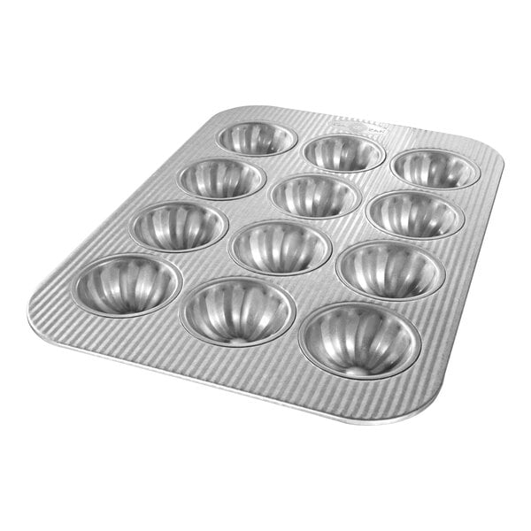 A Chicago Metallic fluted mini cake pan with 12 compartments.