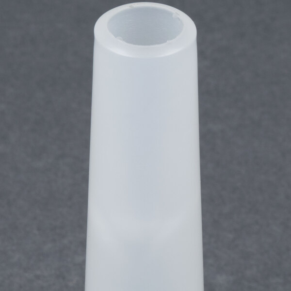 A white plastic cone with a small hole at the end.