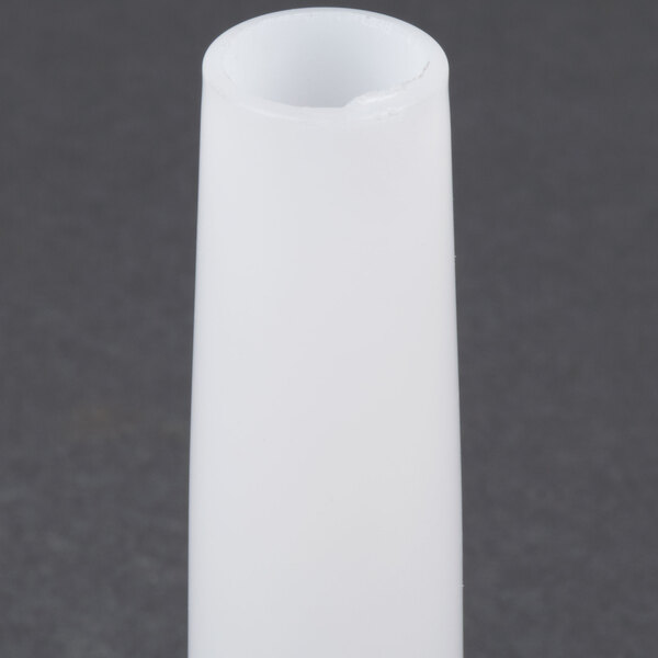 A white cylindrical Backyard Pro Sausage Stuffer tube with a small hole.