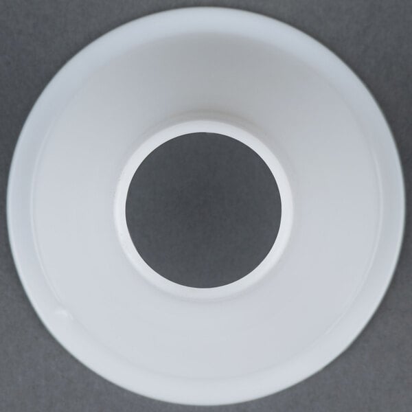 A white plastic circle with a hole in it.