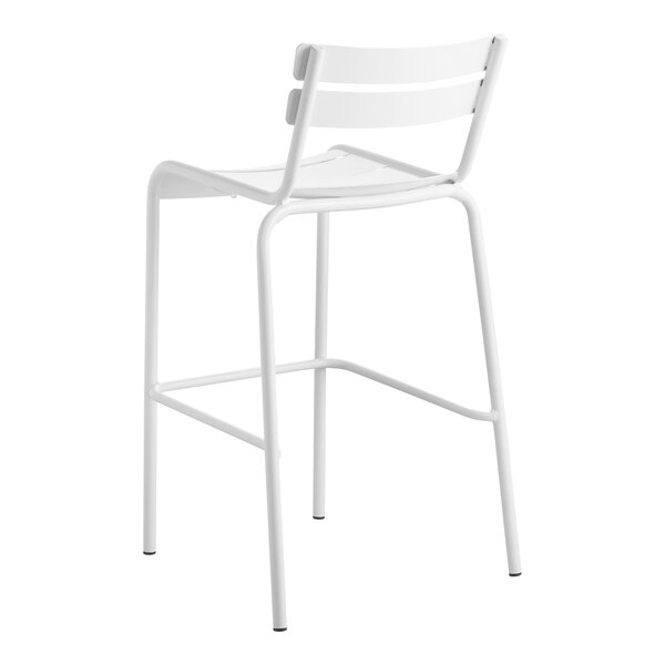 A white Lancaster Table & Seating outdoor barstool with a white seat and back.