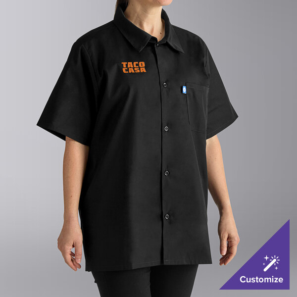 A woman wearing a black Uncommon Chef cook shirt.