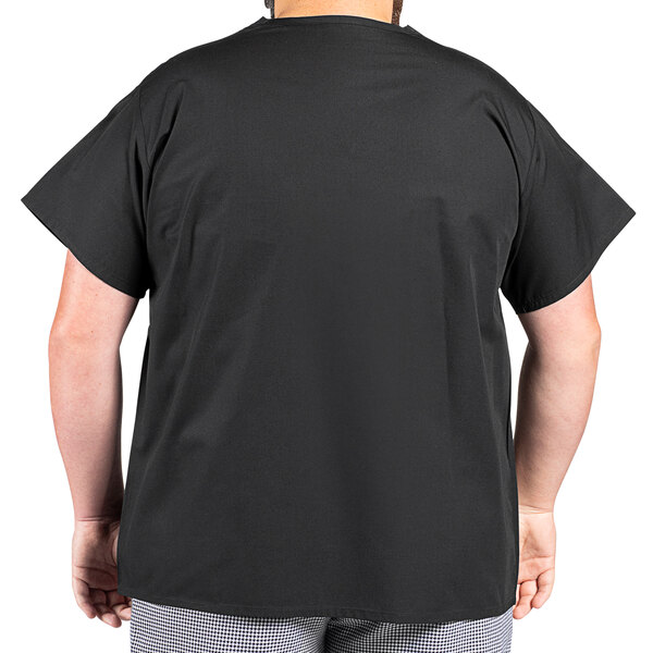 A man wearing a black Uncommon Chef cook shirt.