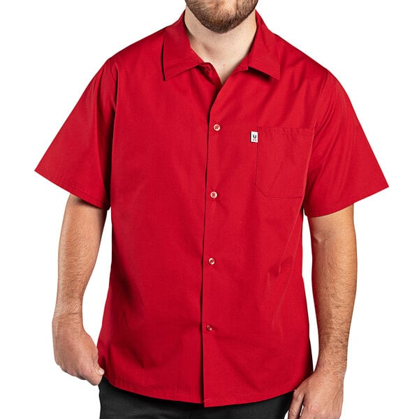 A man wearing a red Uncommon Chef cook shirt.