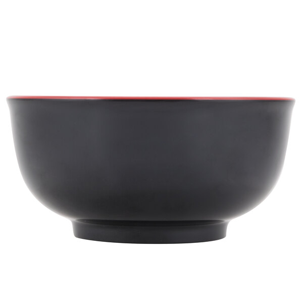 A black melamine bowl with a red rim.
