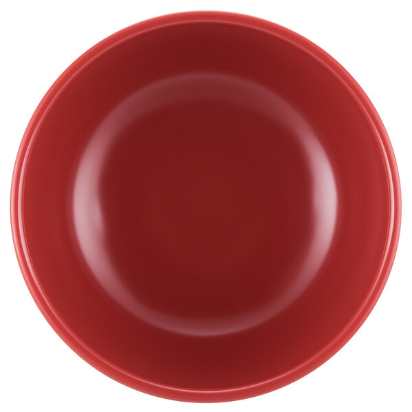 A close-up of a red GET melamine bowl with a white border.