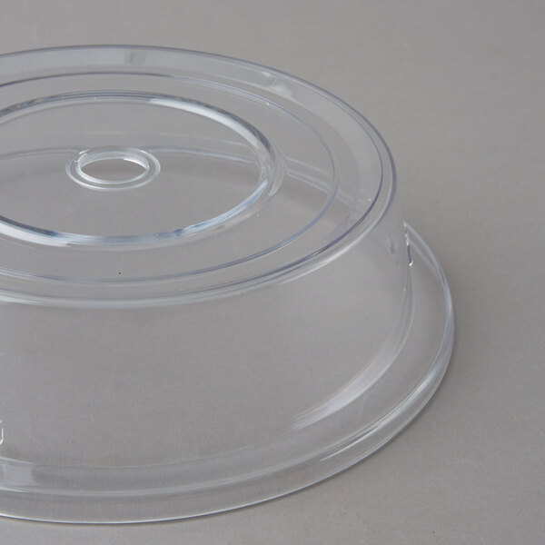 A Carlisle clear polycarbonate plate cover with a circular hole.
