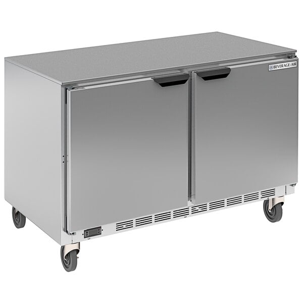 A silver Beverage-Air 48" dual temp undercounter refrigerator / freezer on wheels.
