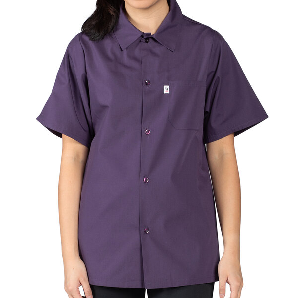 A woman wearing an Uncommon Chef eggplant cook shirt.
