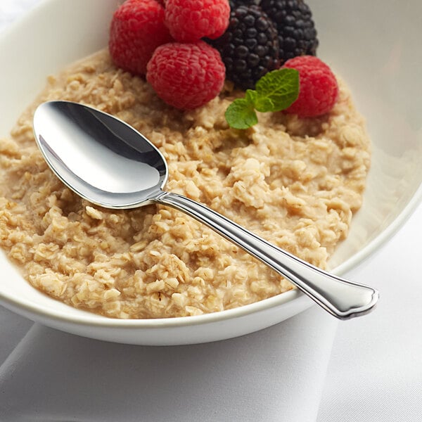 a spoon in a bowl of oatmeal