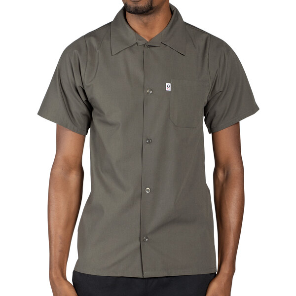 An olive green men's short sleeve cook shirt with a pocket.