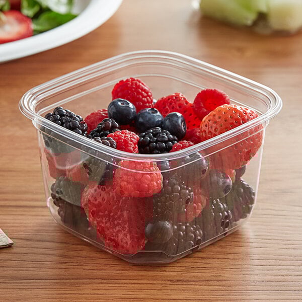 a plastic container of berries