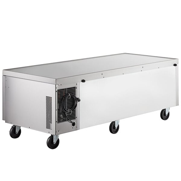 A large rectangular silver Beverage-Air freezer chef base with wheels.