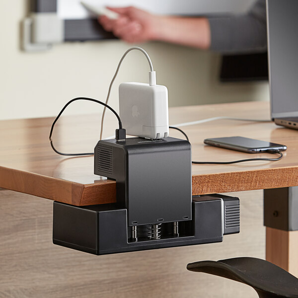 A Luxor KwikBoost EdgePower charging unit clamped to a table.