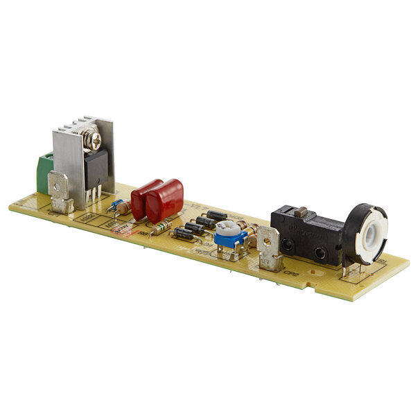The circuit board for a Galaxy immersion blender with a red circuit board and silver and black components.