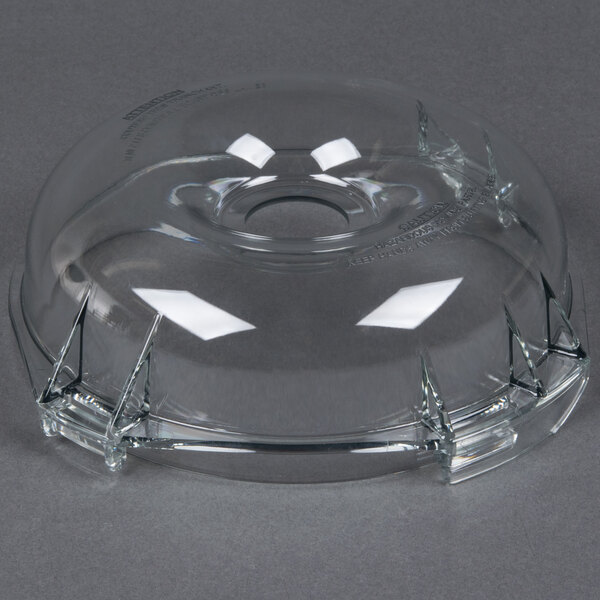 A clear container with a hole in it.