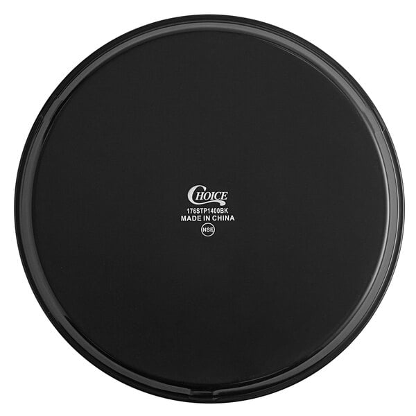 A black round non-skid serving tray with white text on it.