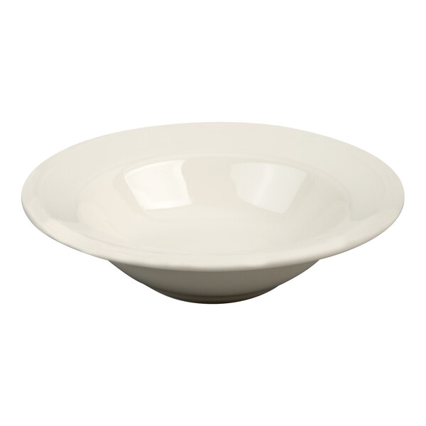 A shallow, round, ivory-colored dish with a wide rim and a small central bowl.