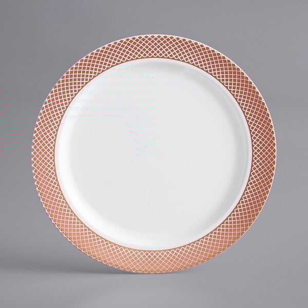 A white plastic plate with rose gold lattice design.